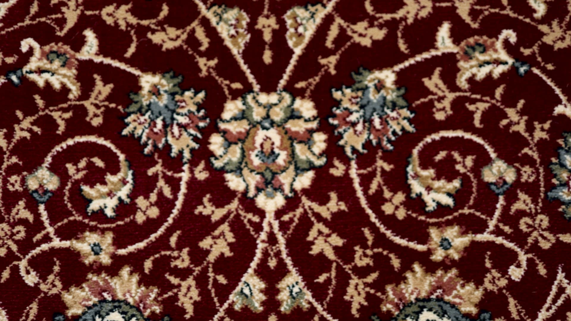 Hazel Red/Ivory rug, filmed on a wood floor