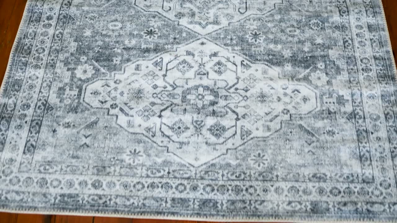 Ripple Grey rug, filmed on a wood floor